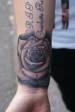 Black and grey rose on wrist